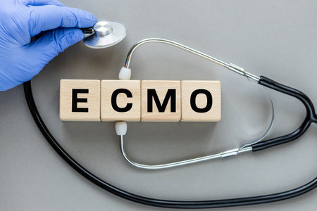 Word ecmo written on wooden cubes. Healthcare concept for hospital, clinic and medical business....