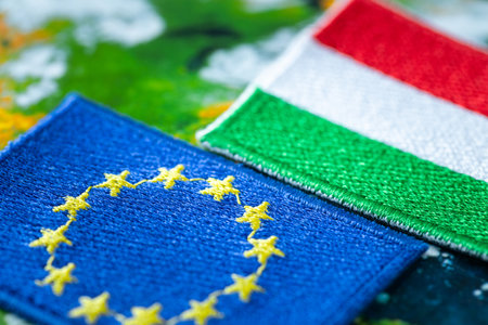 Hungary and European Union patches overlapping, Concept of cooperation between EU countries, Flags of Hungary and European Union, close upの写真素材