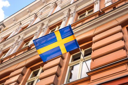 swedish flag flying on a buildingの写真素材