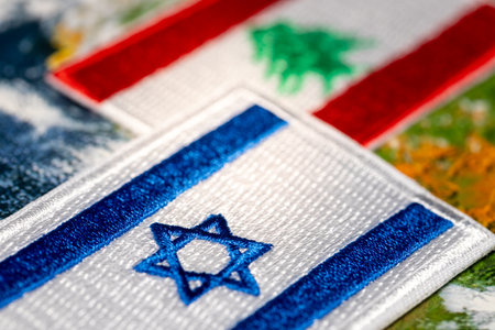 Embroidered flags of Israel and Lebanon, Symbols of countries. Political concept, Situation in the Middle East, Mutual relationsの写真素材