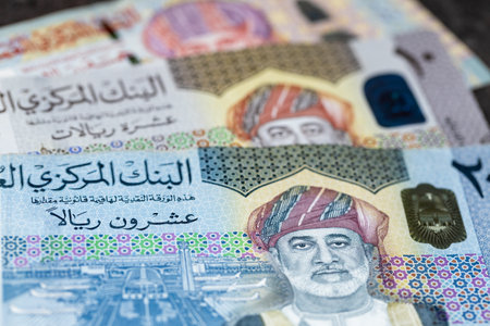 Oman rials banknotes lying on dark table, Finance business concept