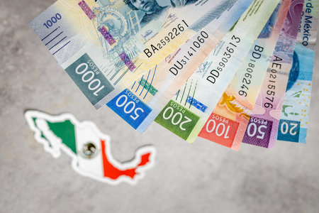 Mexico money and national emblem, Gray background, flat lay, Financial background, Mexican peso,...