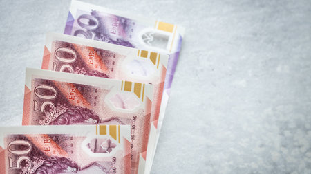 United Kingdom money. UK pounds on gray tabletop. Financial background. British business concept....