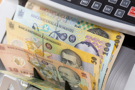 Romania money. Romanian banknotes in money counter. Business and financial conceptの写真素材