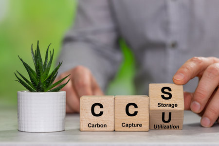Wooden cubes form the symbol CCS (carbon capture storage) and CCU (carbon capture utilization). Environmental Business concept, Net zero action, Save energy, green energy, reduce carbon footprintの写真素材
