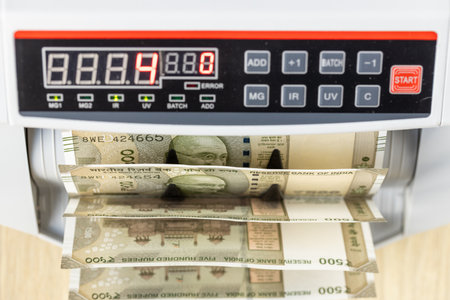 India money, Machine counting Indian 500 rupee notes, Financial and business background, close upの写真素材