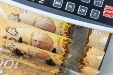 Canada money, Banknote counter with Canadian dollars. Financial and business conceptの写真素材