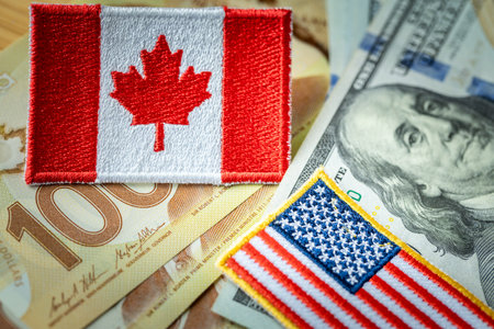 Flags and money US and Canadian dollars. The concept of trade between countries. Mutual financial relationsの写真素材