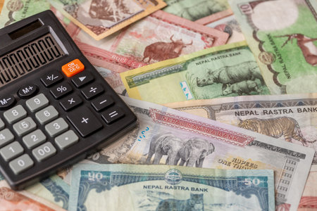 Nepal money, Nepalese rupees and calculator, banknotes, large quantity, All denominations, financial business background. Settlements and currency exchange. closeupの写真素材