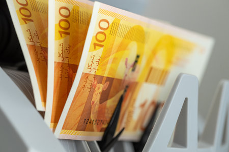 Israel money, Financial concept. 100 shekel banknotes in money counter. Tourism economy and...