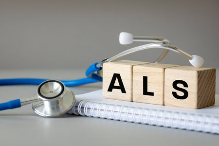The term ALS, which stands for Advanced Life Support or amyotrophic lateral sclerosis. The sign on the wooden blocks in the doctor's office. copy spaceの写真素材