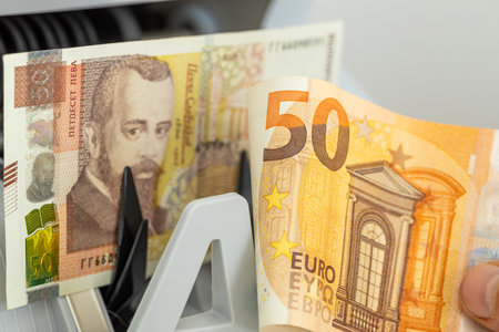 Bulgaria euro, business concept. 50 lev and 50 euro banknotes, Money counter. Adopting the euro in...
