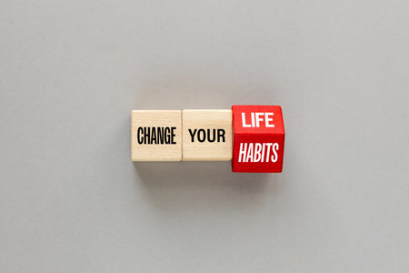 LIFE and HABITS concept. One letter on wooden blocks changes the word Change Your Life and Habits,...