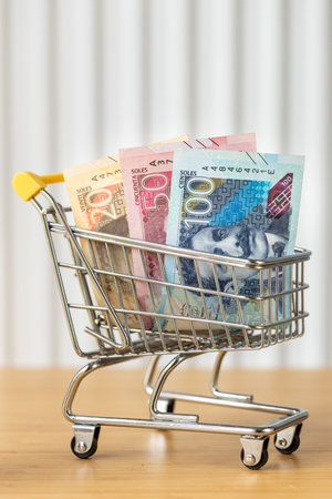 Peru money. A shopping cart with Peruvian soles. Financial and economic concept. Growing cost of living in Peru, rising prices of goods and services. Vertical photo. close upの写真素材