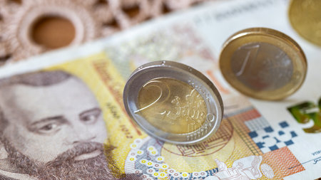 Eurozone Bulgaria, Financial and economic concept. Euro coins and a 50 Bulgarian lev note lying on a tablecloth. close upの写真素材