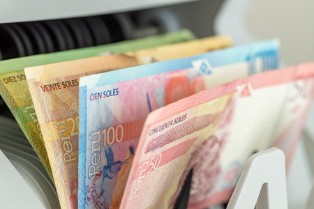 Peruvian soles in a bill counter. Financial concept. Peru money. Business background. Close up