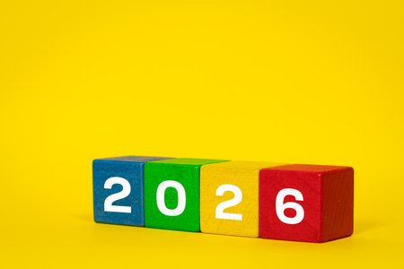 The date on the colored blocks. Beautiful yellow background. Copy space. Business concept