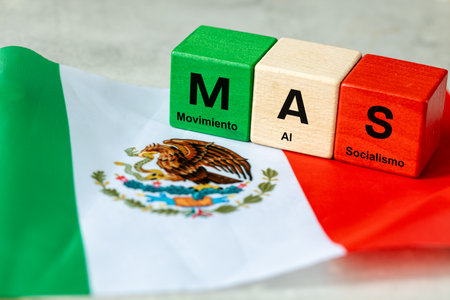 MAS symbol. Abbreviation for Movimiento al Socialismo (English: Movement for Socialism) a social movement in Latin America. A sign on wooden blocks and the flag of Mexico.の写真素材