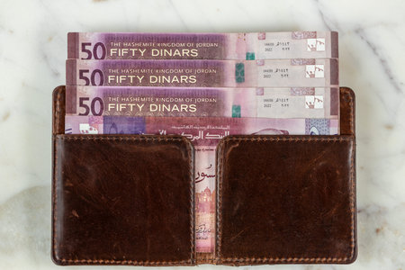 Jordanian currency. 50-dinars bills. Flat lay. Close up. Business and financial concept