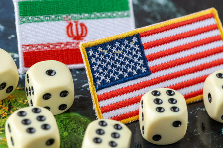 United States vs. Iran. Business and trade concept. Symbols of both countries and dice. Close up