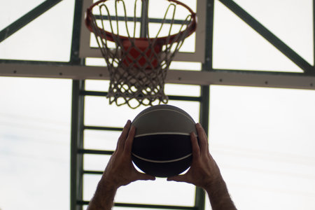 basketball player practicing and posing for basketball and sports athlete concept in sports gym