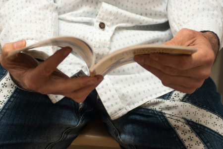 Man reading a book. Close-up of a man reading a book.