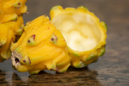 Tropical fruit of dragon fruit on a dark background close up