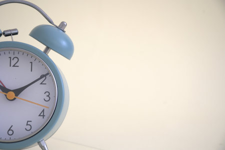 Retro alarm clock on white background with copy space for text.のeditorial素材