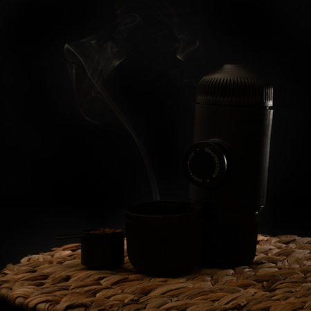 Vacuum flask with a filter on a dark background with smokeのeditorial素材