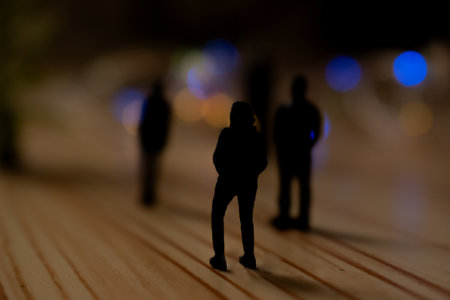Silhouette of a group of miniature people. Selective focus.の写真素材