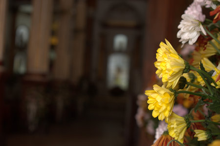 Bouquet of flowers in the church. Yellow and white flowers.