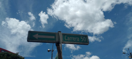 Street Sign the Direction Way to Take A Self Isolated on Blue Skyの写真素材