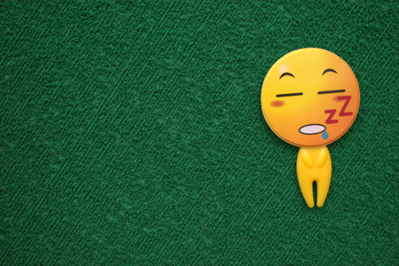 Funny smiley emoticon on green background, 3d renderの写真素材