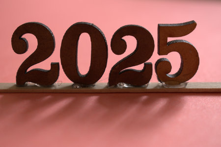 Happy New Year 2015 in wood letters on a pink background. Holiday concept.の写真素材