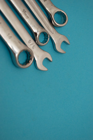 Spanners of different sizes on a blue background close-up.の写真素材