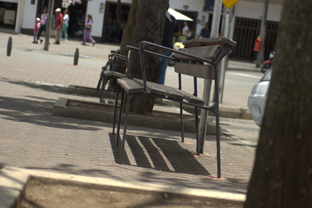 Empty bench on the street in the center of Lisbon, Portugal.の写真素材