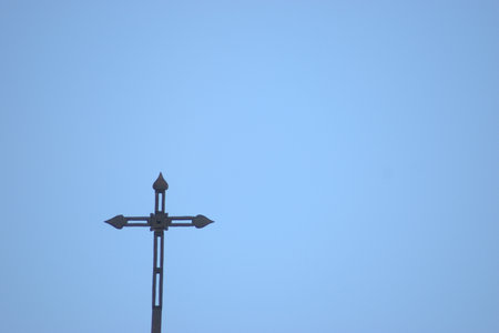 Cross on blue sky background. Cross on blue sky background. Cross on blue skyの写真素材