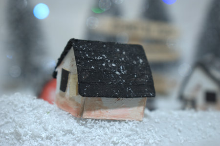 Miniature houses in the snow. Christmas and New Year concept.の写真素材