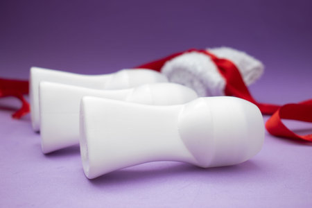 Deodorant roll-on on purple background. Shallow dof.の写真素材