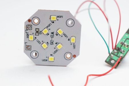 Electronic circuit board on white background. Close-up view.
