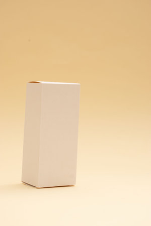 Blank white box on a beige background with copy space.