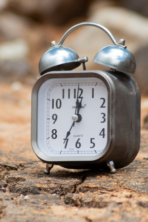 Old alarm clock on wood background.の写真素材