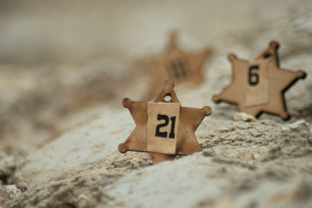 Wooden stars on a stone background. Selective focus and shallow depth of field.