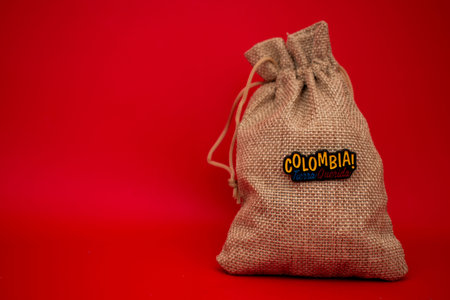 Coffee bag on a red background with the inscription Colombia.の写真素材