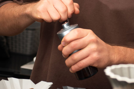 Close-up of a person using a spray canの写真素材