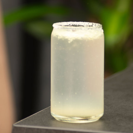 Cold lemonade in a glass on a tableの写真素材