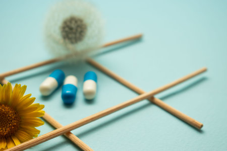 Colorful medical pills with floral elements and geometric cross composition