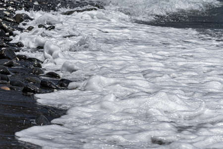 Rocks and sand in the shoreの写真素材