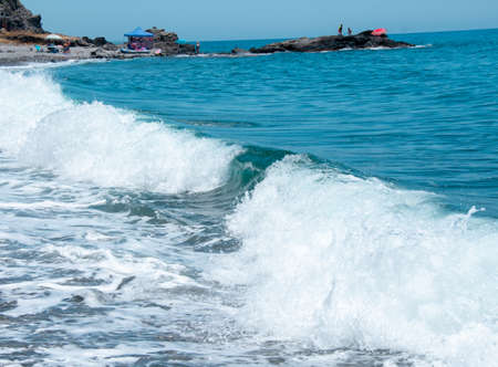 Waves in the blue water in Malagaの写真素材