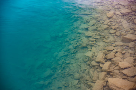 Bottom of Lake Brienz Rocky Fresh Water Increasing in Depth into Deep Beautiful Blueの写真素材